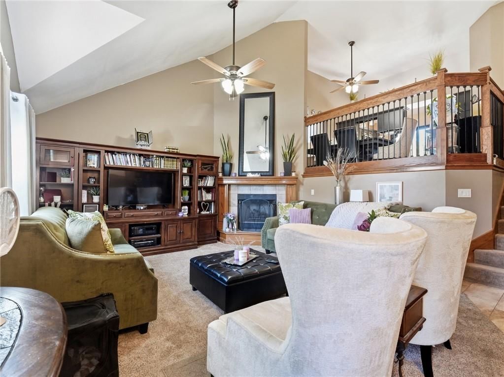 Tall ceilings, fireplace and wall of windows at 337 NE Dreamweaver Avenue, Lee's Summit, MO 64086