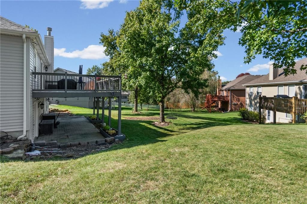 Big backyard, mature trees and flat lot at 13470 Timber Park Lane, Platte City, MO 64079