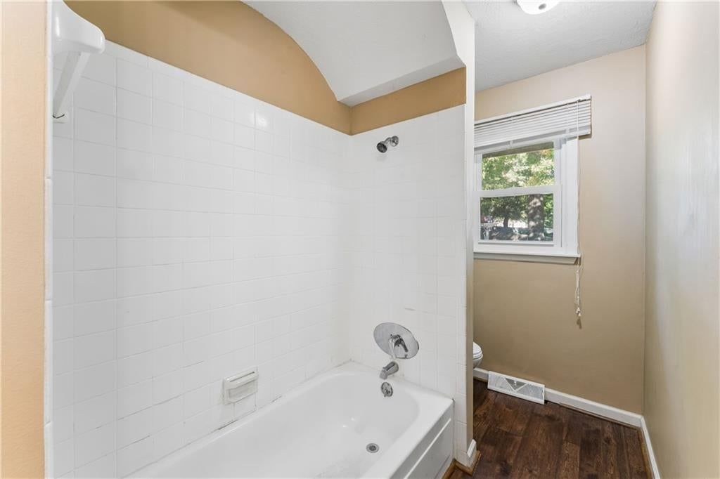Finished basement, fireplace and exposed brick wall at 700 NE 55TH Street, Kansas City, MO 64118