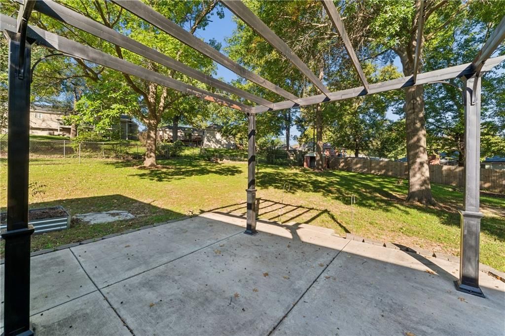 Deck, big backyard and pergola at 700 NE 55TH Street, Kansas City, MO 64118