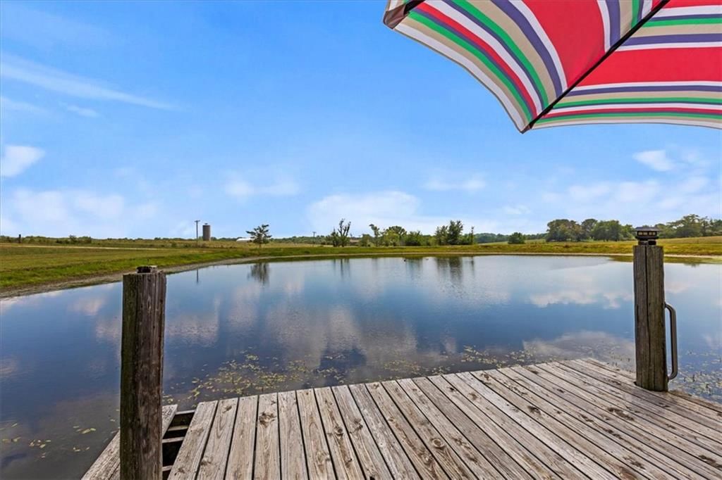 Pond or creek visible on the lot at 25400 S State Route M, Garden City, MO 64747