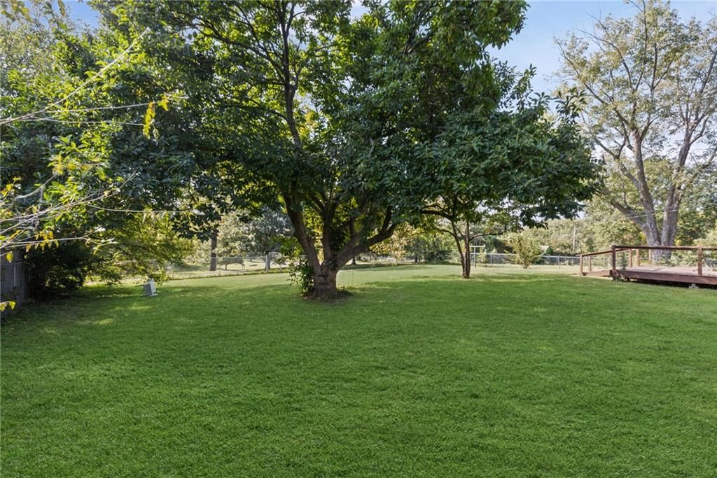 Big backyard, mature trees and flat lot at 10137 E 80th Street, Raytown, MO 64138