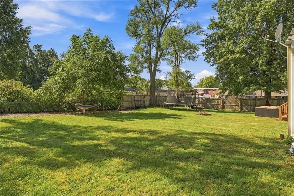 Big backyard, fenced yard and mature trees at 725 W Elm Street, Olathe, KS 66061