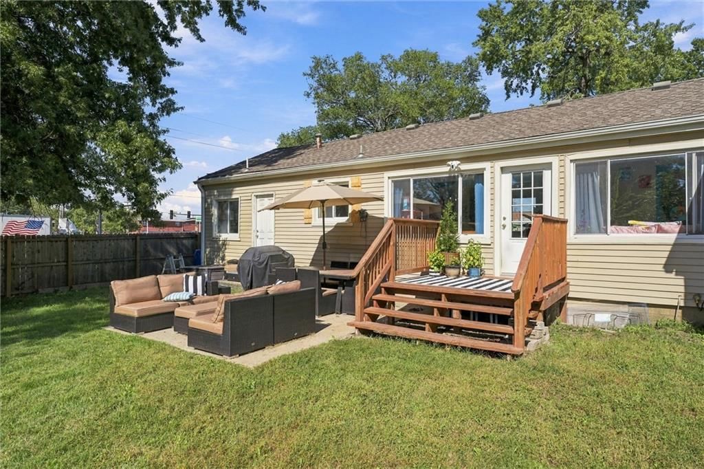 Deck, fire pit and concrete patio at 725 W Elm Street, Olathe, KS 66061