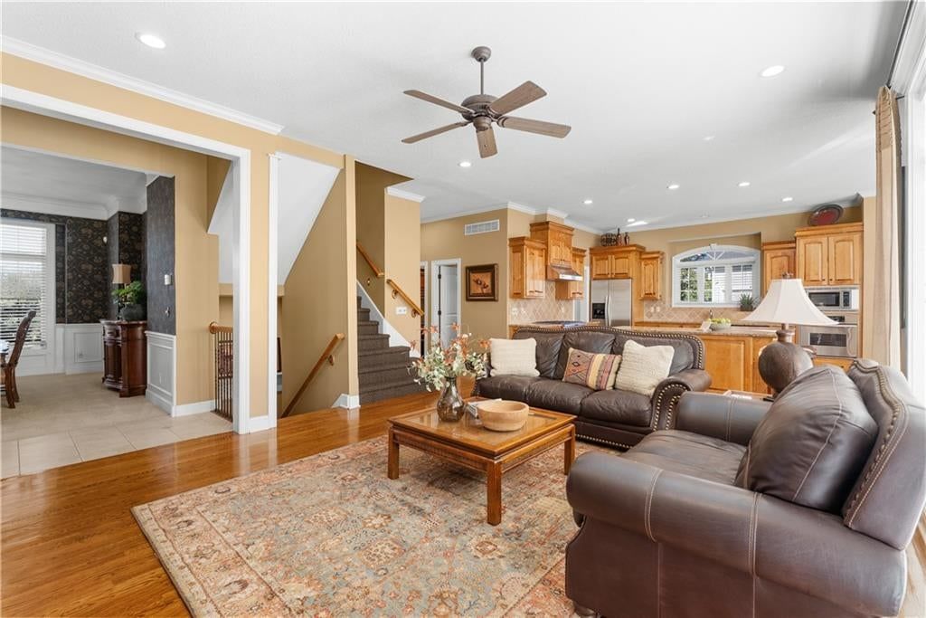 Open floor plan, hardwood floors and recessed lighting at 311 NW Rockwood Court, Lee's Summit, MO 64081