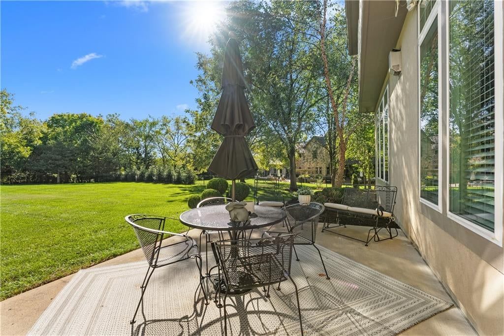 Covered patio and concrete patio at 311 NW Rockwood Court, Lee's Summit, MO 64081