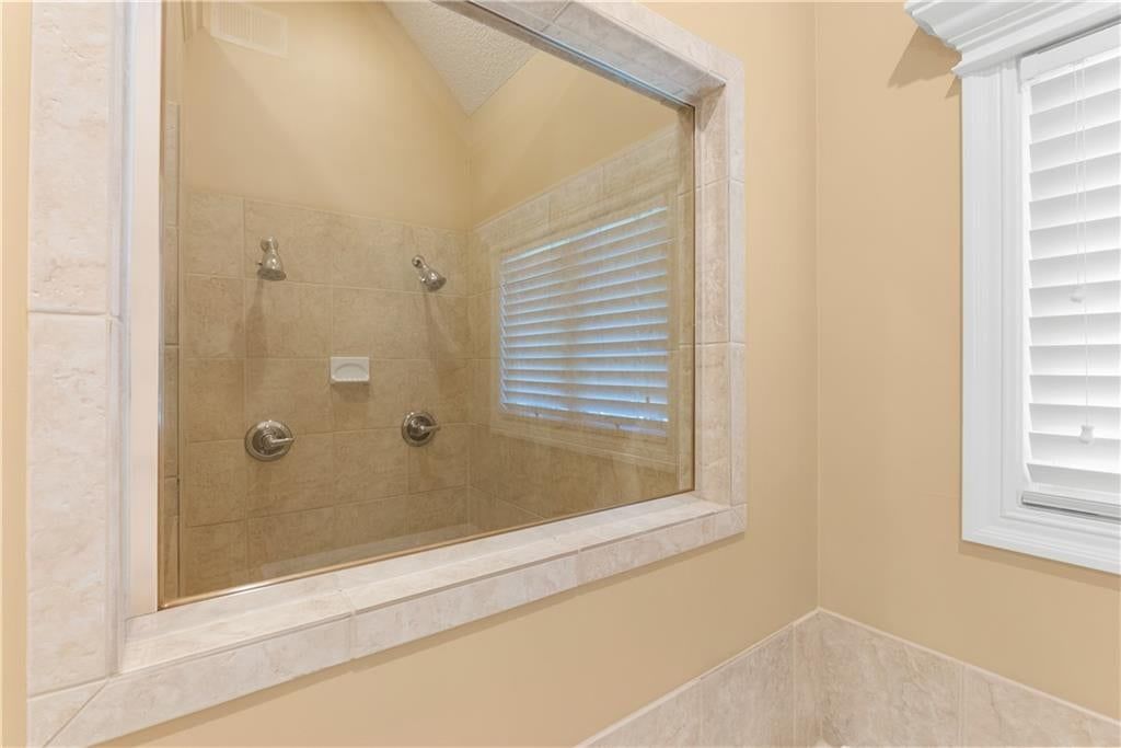 Tiled shower at 311 NW Rockwood Court, Lee's Summit, MO 64081