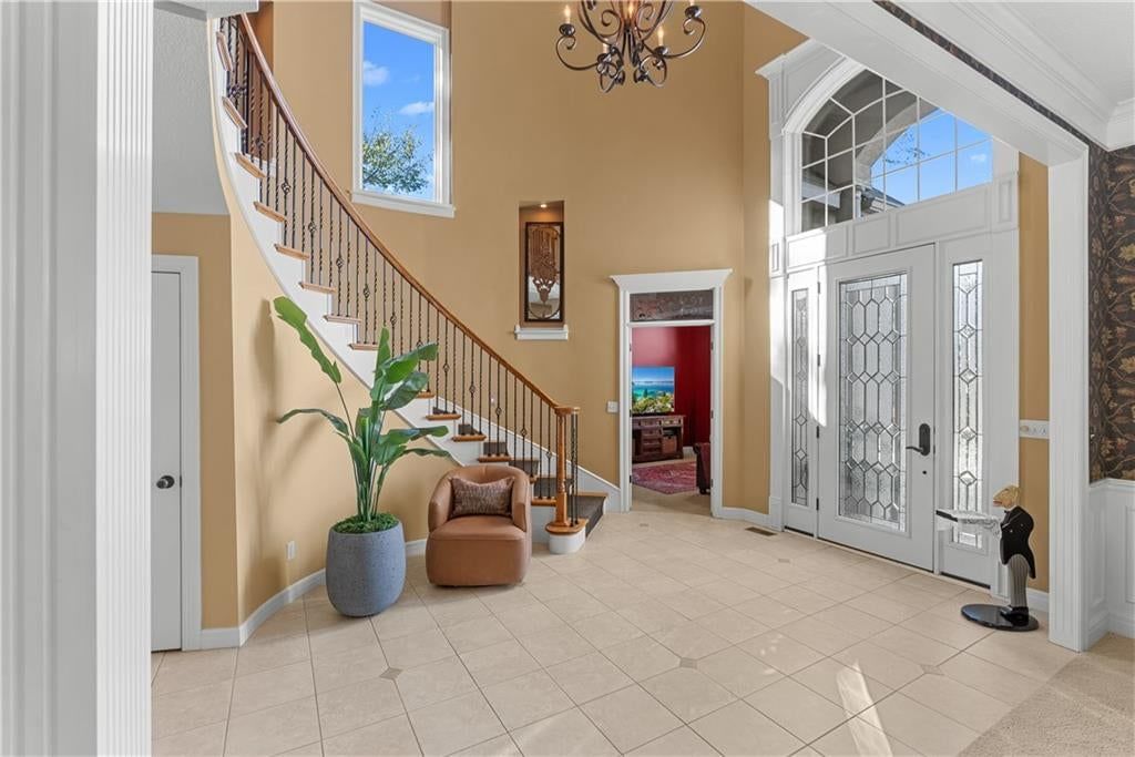 Curved staircase, staircase and iron stair railing at 311 NW Rockwood Court, Lee's Summit, MO 64081