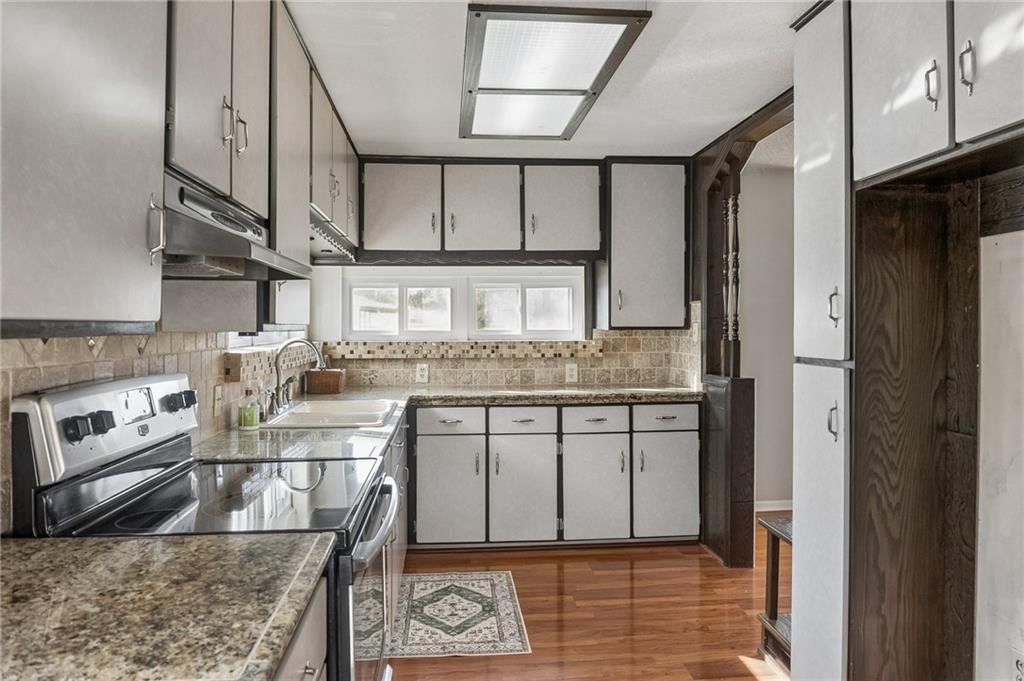 Granite counters, stainless steel appliances and electric range at 26876 Tonganoxie Drive, Leavenworth, KS 66048