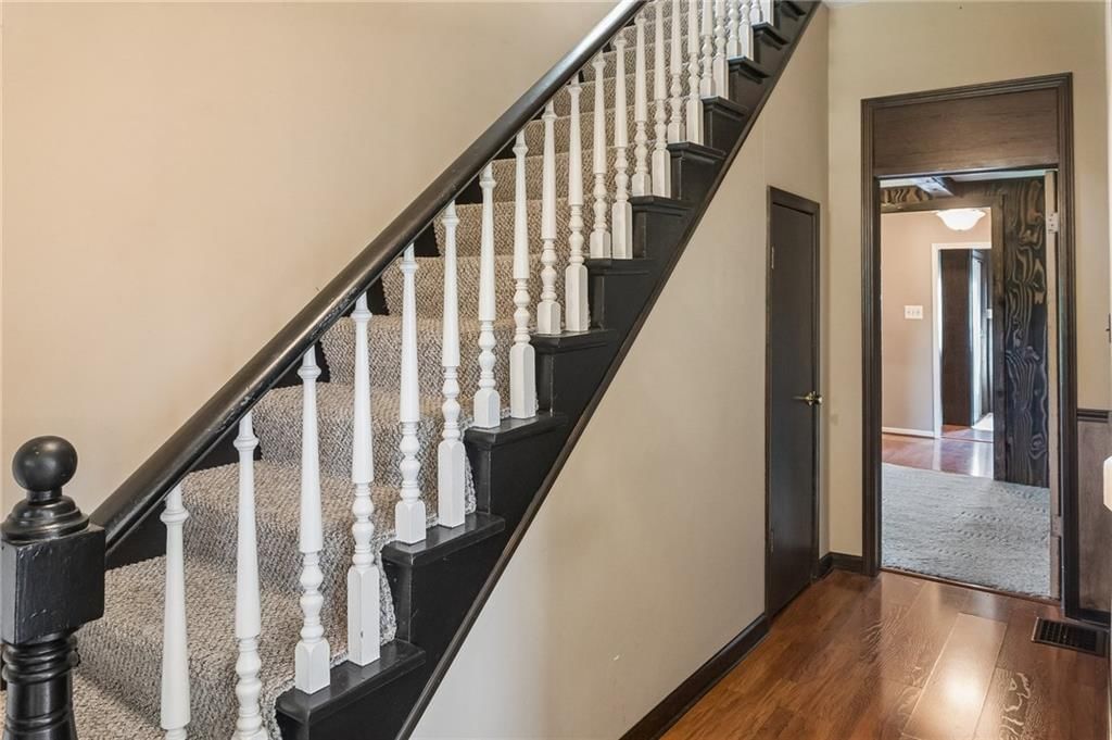 Staircase and wood stair railing at 26876 Tonganoxie Drive, Leavenworth, KS 66048