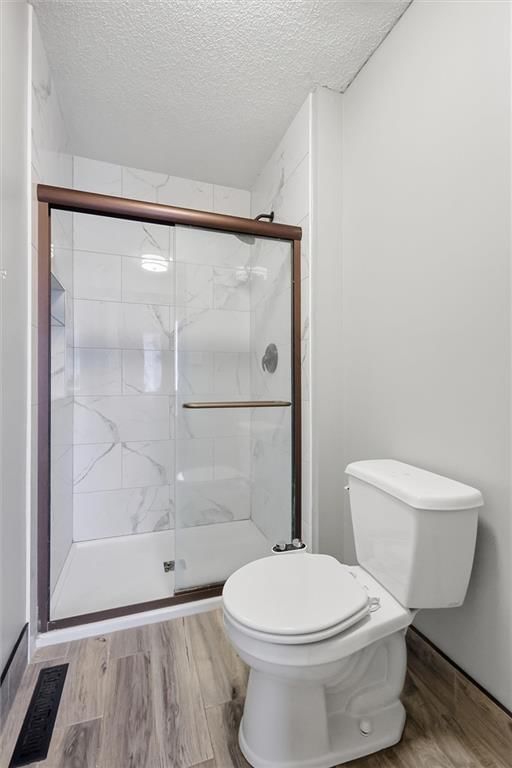 Walk-in shower and tiled shower at 701 NW Rosaceae Drive, Blue Springs, MO 64015
