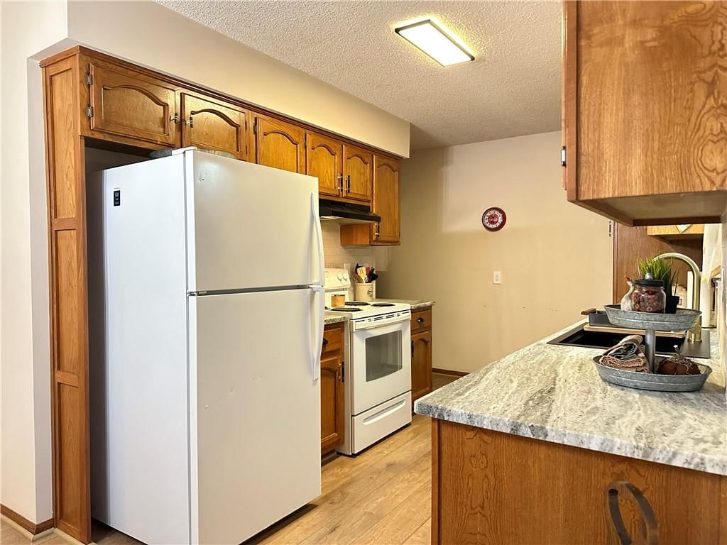 White appliances and electric range at 16003 Allen Street, Belton, MO 64012