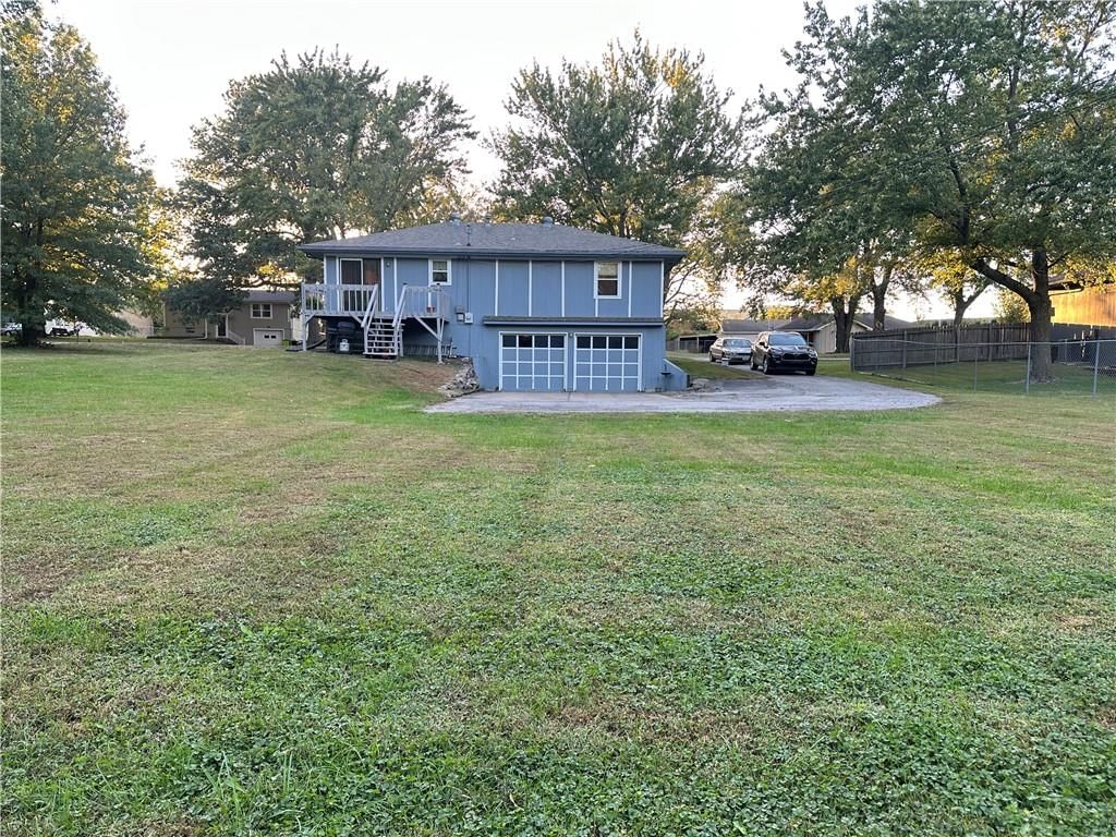 Attached garage and concrete driveway at 16003 Allen Street, Belton, MO 64012