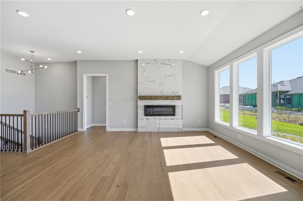 Tall ceilings, fireplace and hardwood floors at 18585 W 195th Street, Spring Hill, KS 66083