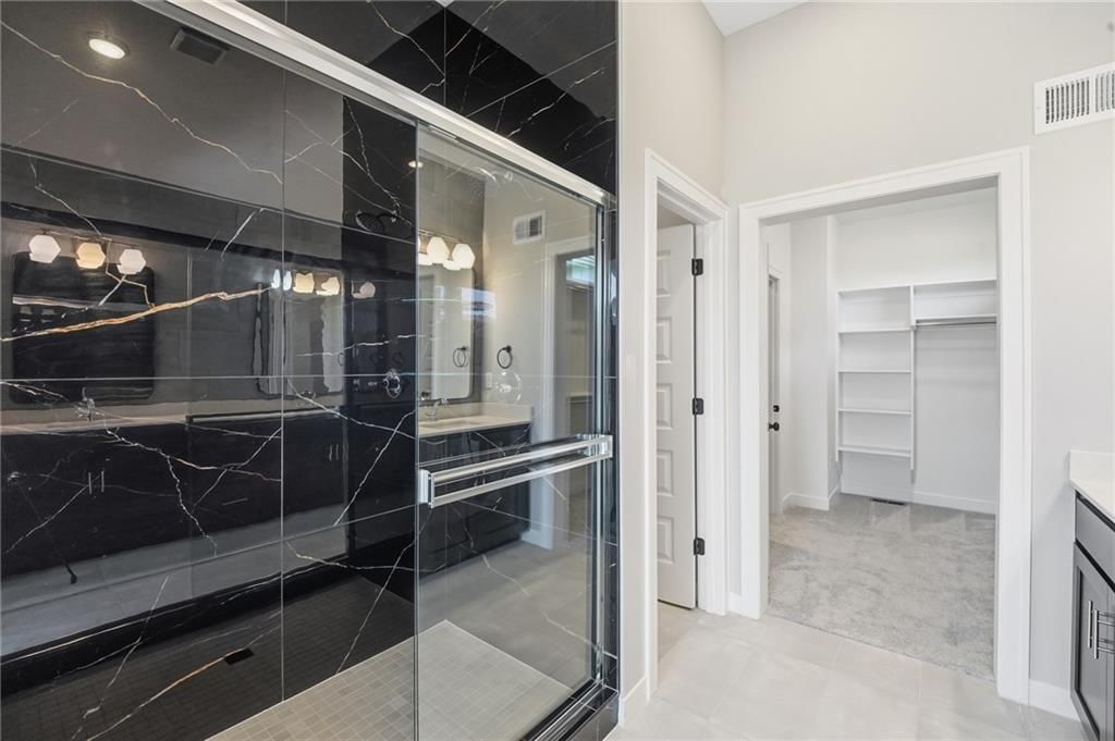 Walk-in shower and tiled shower at 18585 W 195th Street, Spring Hill, KS 66083