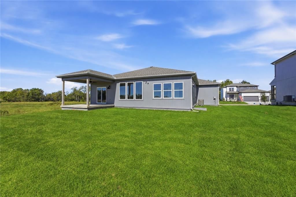 Big backyard, covered patio and concrete patio at 18585 W 195th Street, Spring Hill, KS 66083