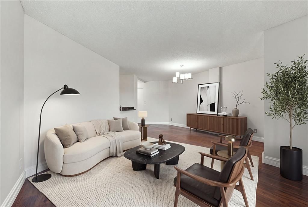 Open floor plan, hardwood floors and white trim at 3838 Rainbow Boulevard #101, Kansas City, KS 66103