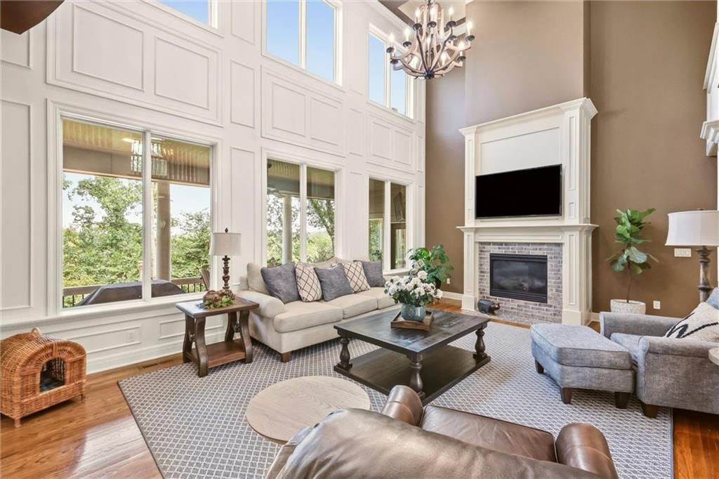 Floor-to-ceiling windows, wall of windows and two-story fireplace at 20108 W 92nd Street, Lenexa, KS 66220