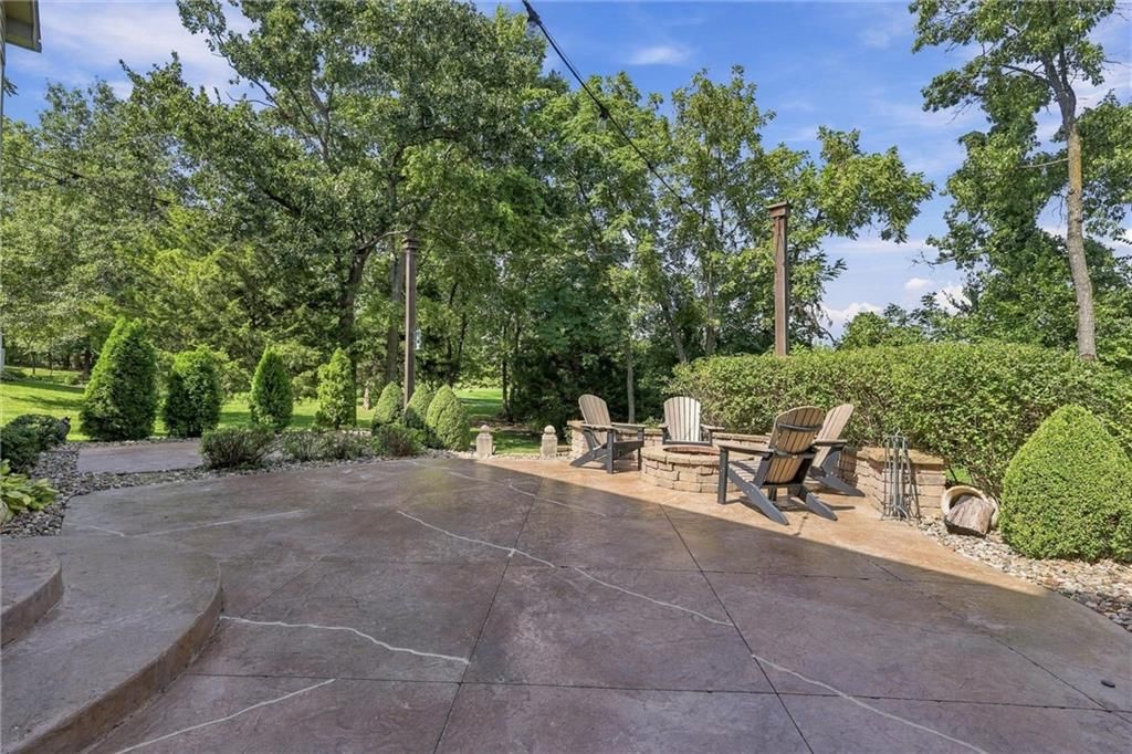 Big backyard, mature trees and flat lot at 20108 W 92nd Street, Lenexa, KS 66220