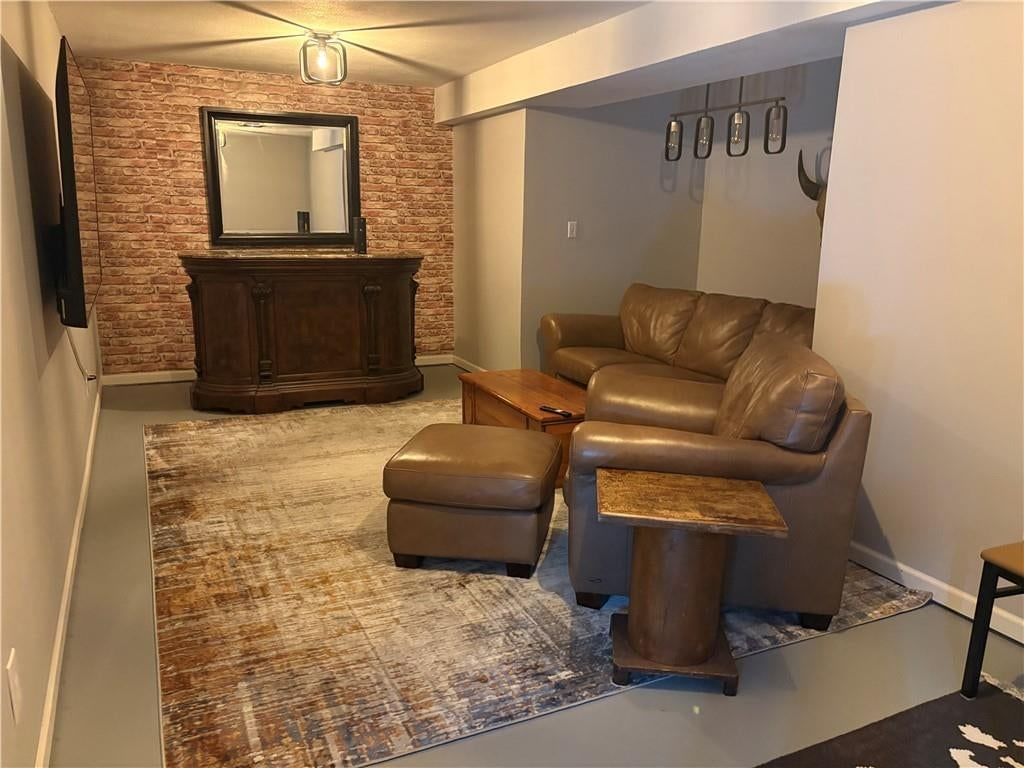Finished basement and exposed brick wall at 5727 N Ames Avenue, Kansas City, MO 64151