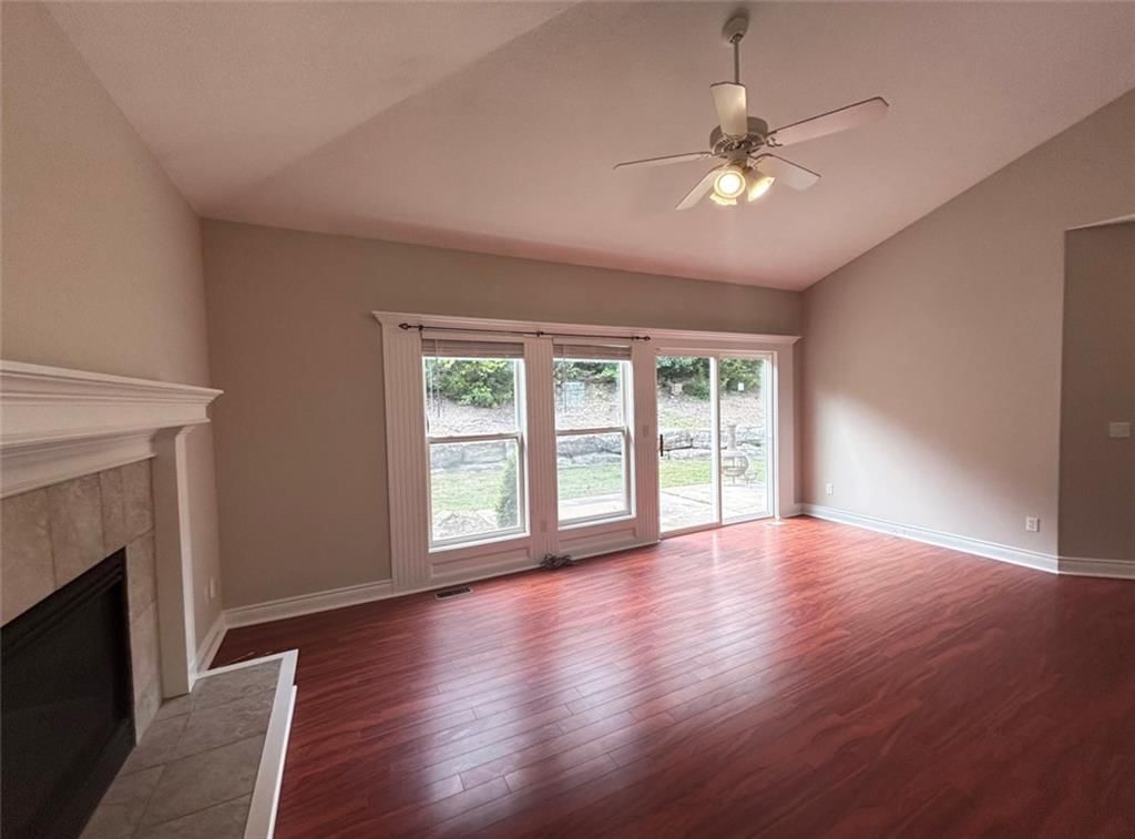 Fireplace and wall of windows at 7826 Mullen, Lenexa, KS 66216