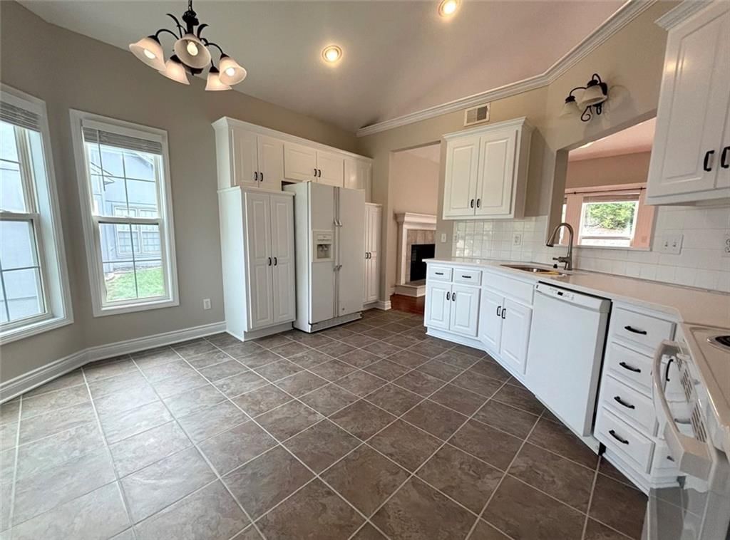 White kitchen, tile floors and white appliances at 7826 Mullen, Lenexa, KS 66216