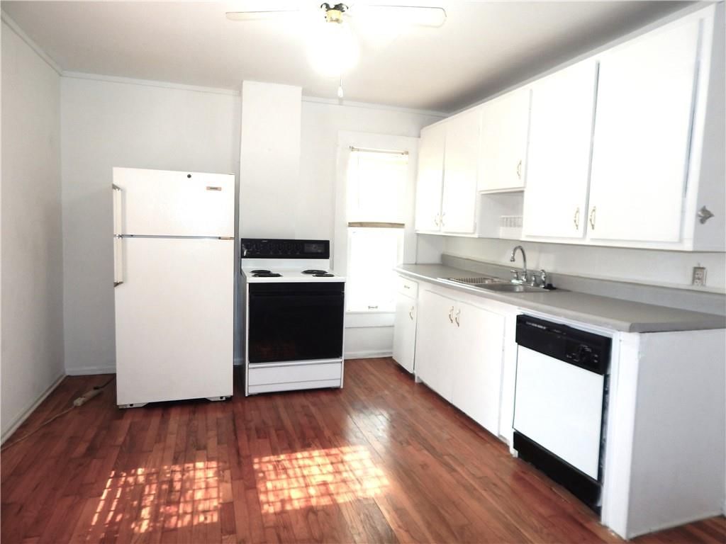 White kitchen, white appliances and electric range at 452 WATER Street, Liberty, MO 64068