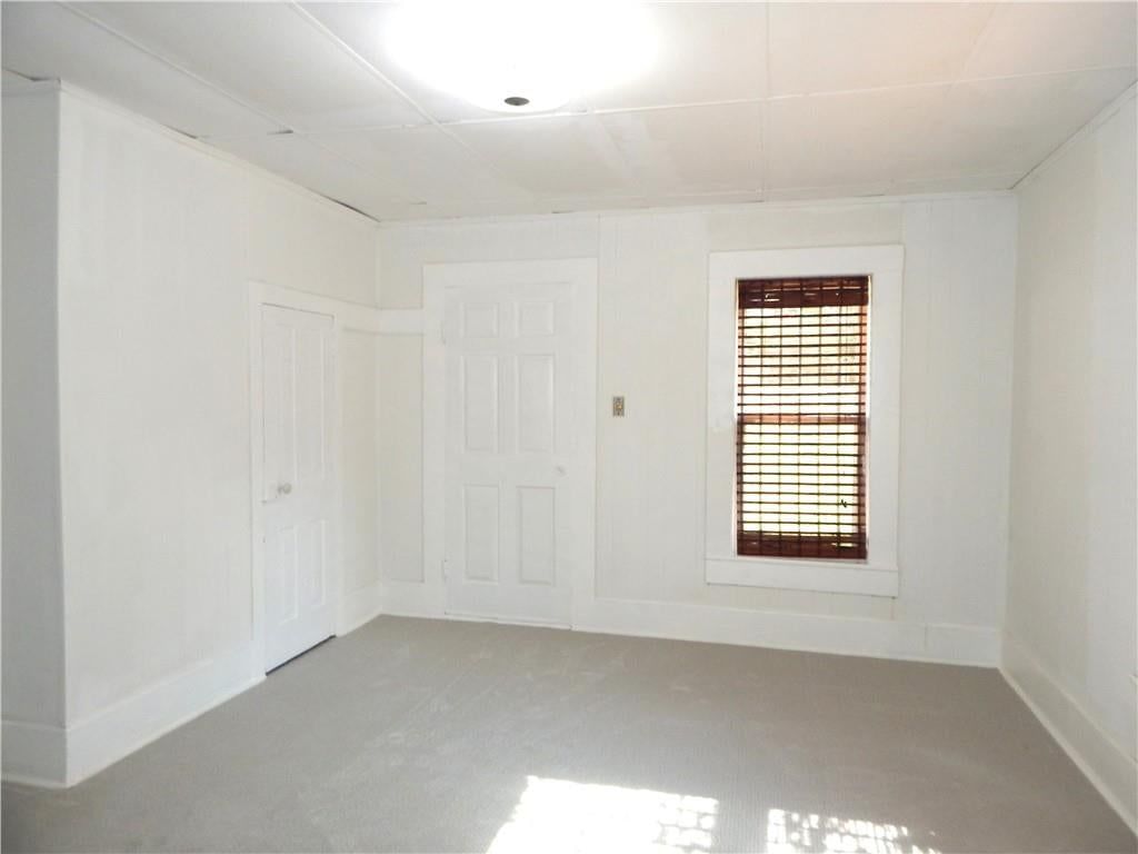 Main-floor primary bedroom and carpet at 452 WATER Street, Liberty, MO 64068