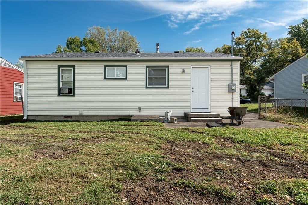 Fenced yard, chain-link fence and concrete patio at 5126 N Corrington Avenue, Kansas City, MO 64119