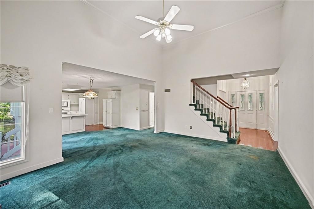 Open floor plan and carpet at 24909 E Blue Mills Road, Independence, MO 64058