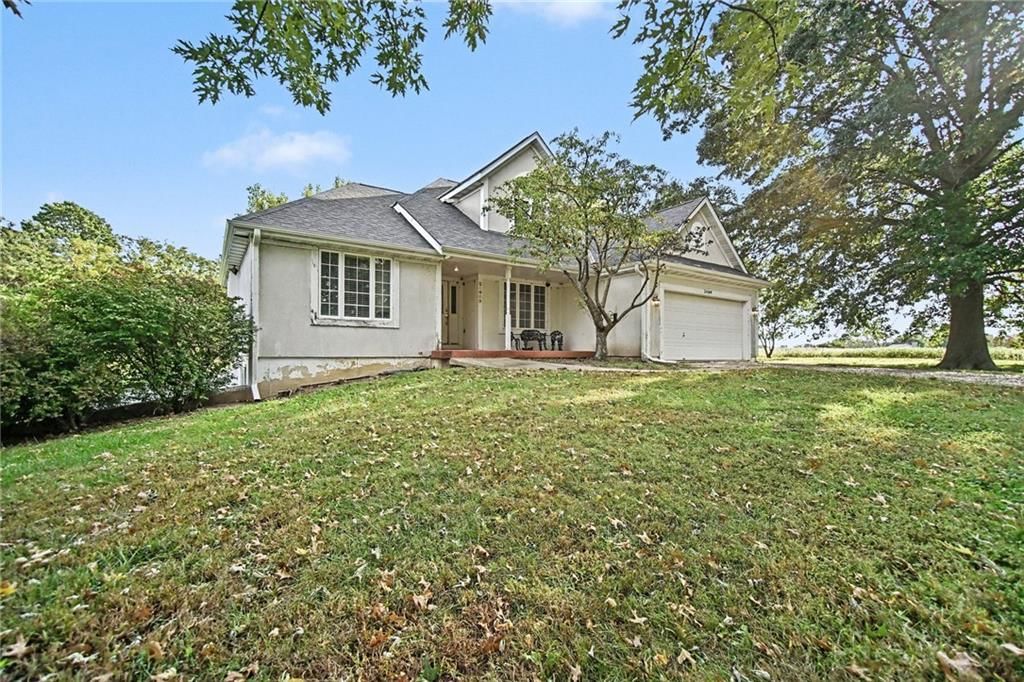 Big backyard, mature trees and flat lot at 24909 E Blue Mills Road, Independence, MO 64058