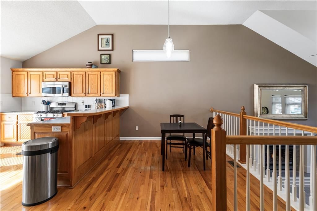 Open floor plan, hardwood floors and breakfast nook at 23707 W 58th Terrace, Shawnee, KS 66226