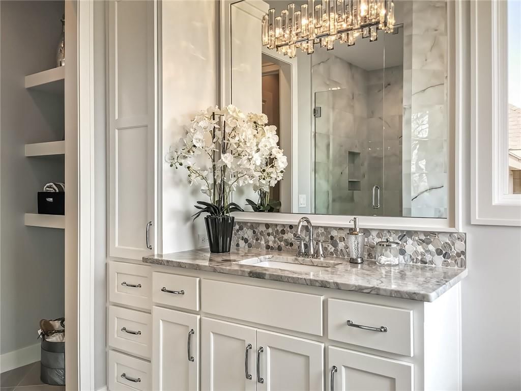 Walk-in shower, tiled shower and frameless glass shower at 10514 N Olive Court, Kansas City, MO 64155
