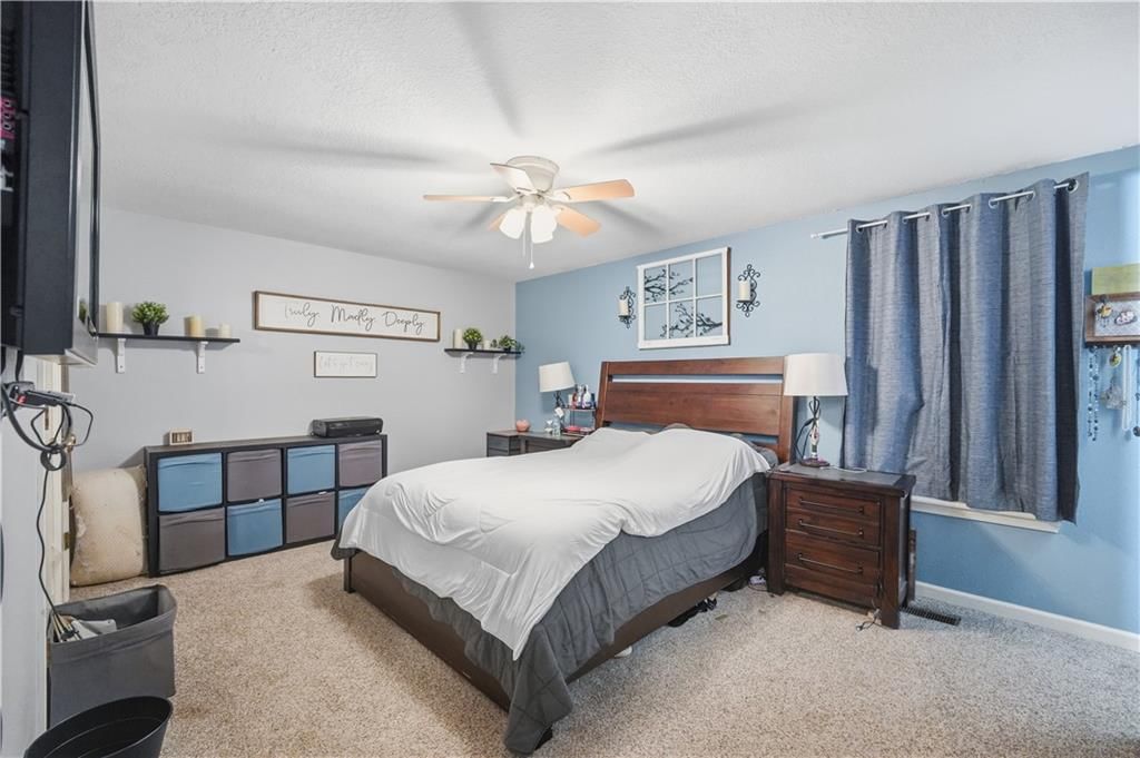 Main-floor primary bedroom at 7415 NW 80th Terrace, Kansas City, MO 64152