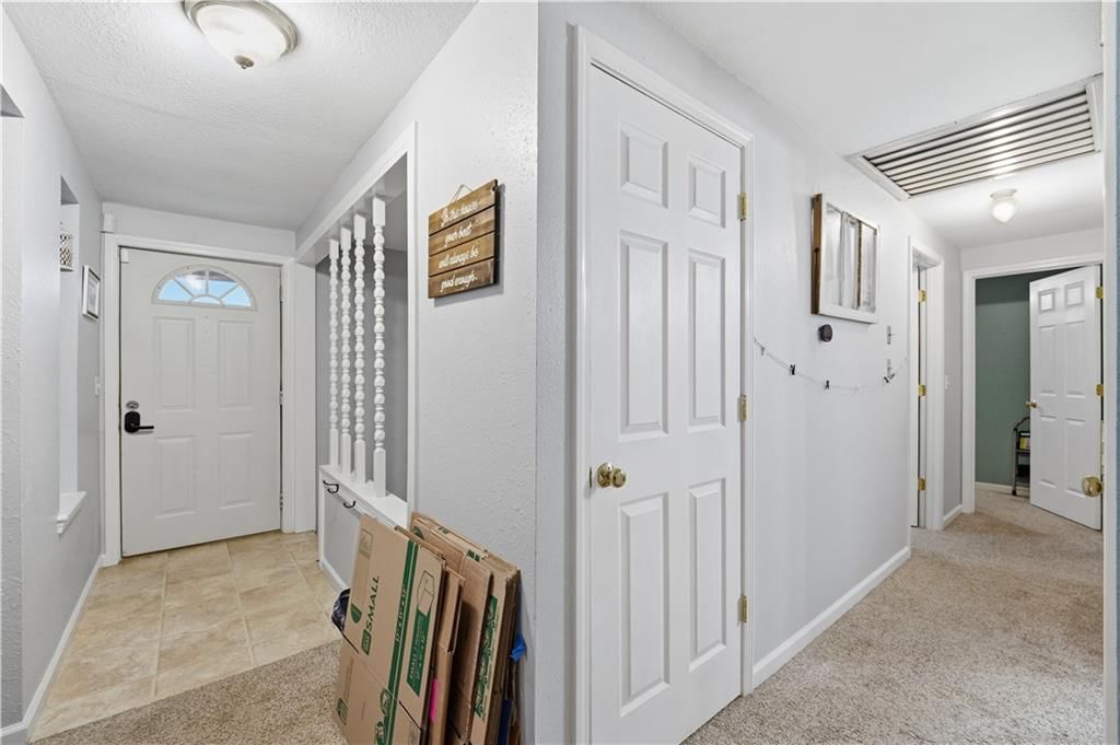 Staircase, wood stair railing and white trim at 7415 NW 80th Terrace, Kansas City, MO 64152