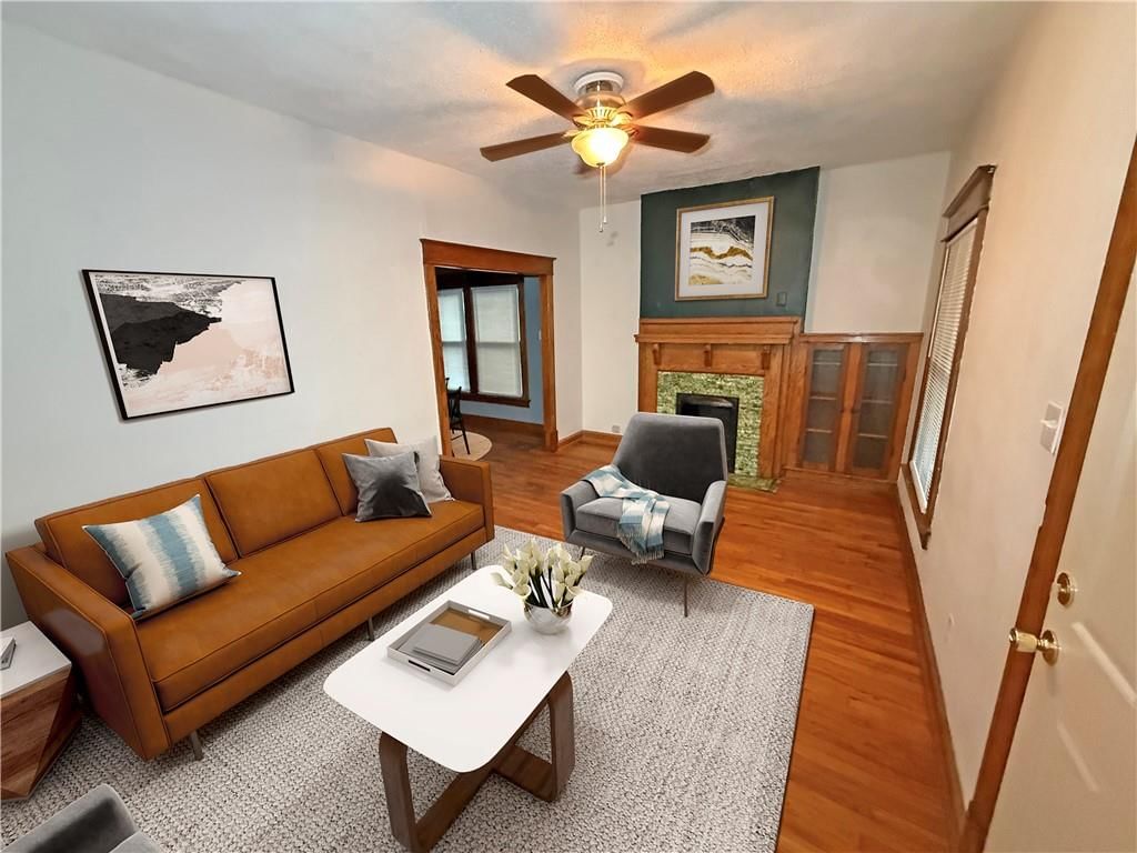 Fireplace and hardwood floors at 4412 Cambridge Street, Kansas City, KS 66103