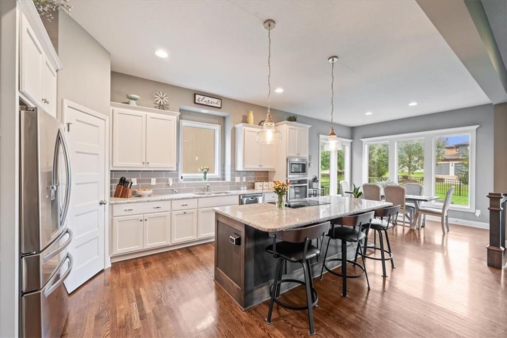 Photo 6: white kitchen cabinets, 24315 W 91st Place, Lenexa, KS 66227