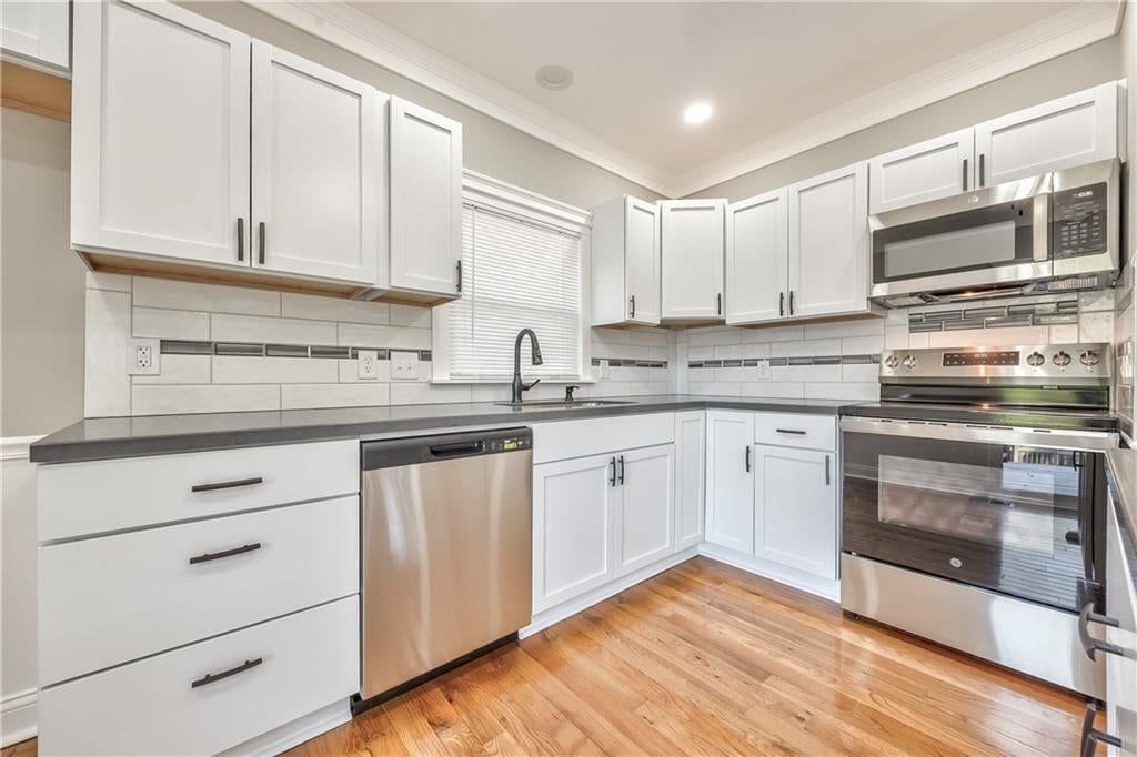 White kitchen, shaker cabinets and stainless steel appliances at 903 N 12th Street, Leavenworth, KS 66048