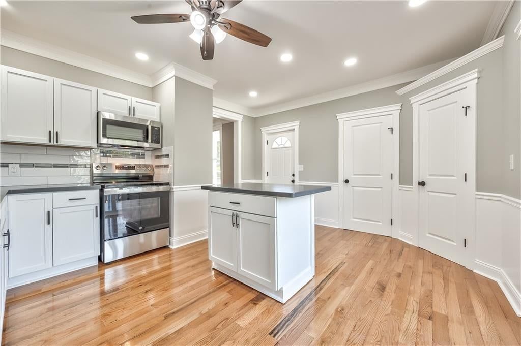 Open floor plan, kitchen island and recessed lighting at 903 N 12th Street, Leavenworth, KS 66048