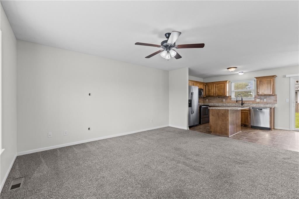 Open floor plan and kitchen island at 502 193rd Street, Smithville, MO 64089