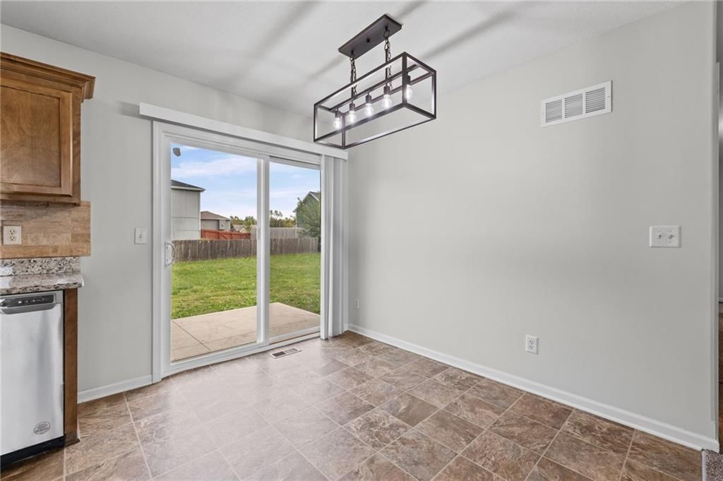Statement lighting and breakfast nook at 502 193rd Street, Smithville, MO 64089