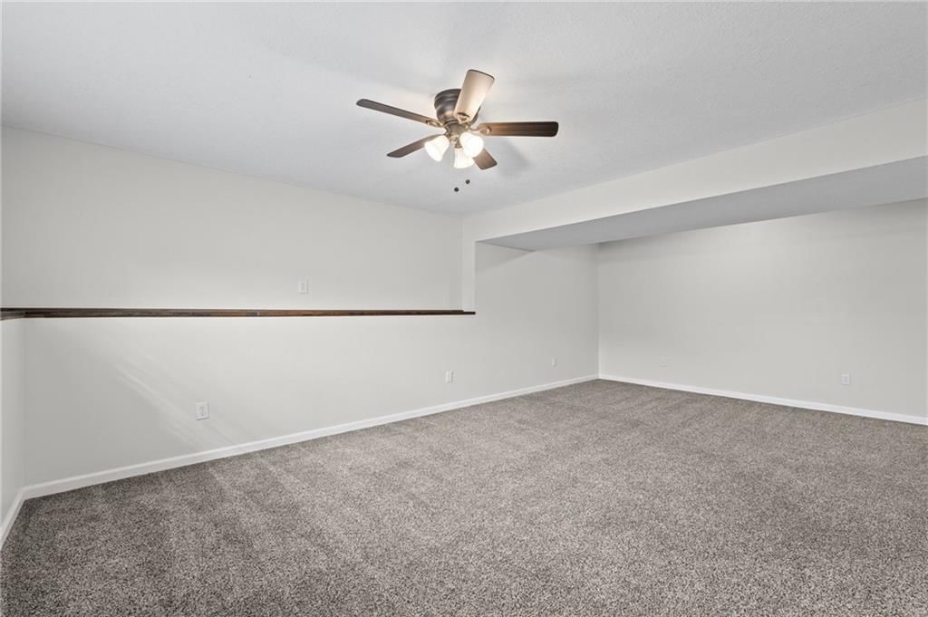 Finished basement, staircase and wood stair railing at 502 193rd Street, Smithville, MO 64089