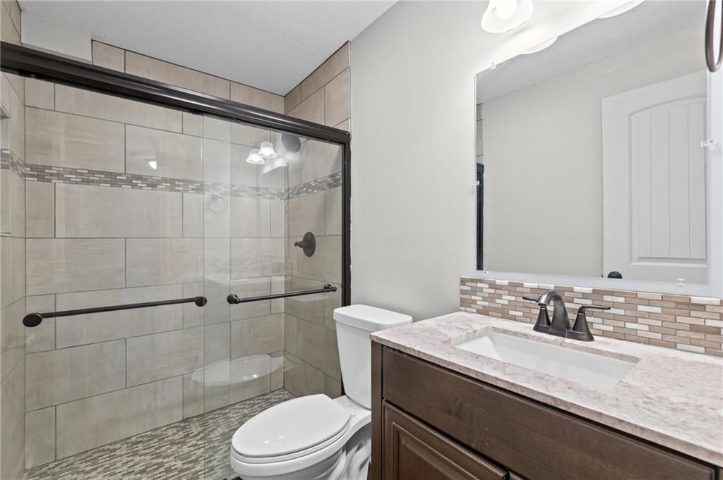Walk-in shower, tiled shower and frameless glass shower at 502 193rd Street, Smithville, MO 64089