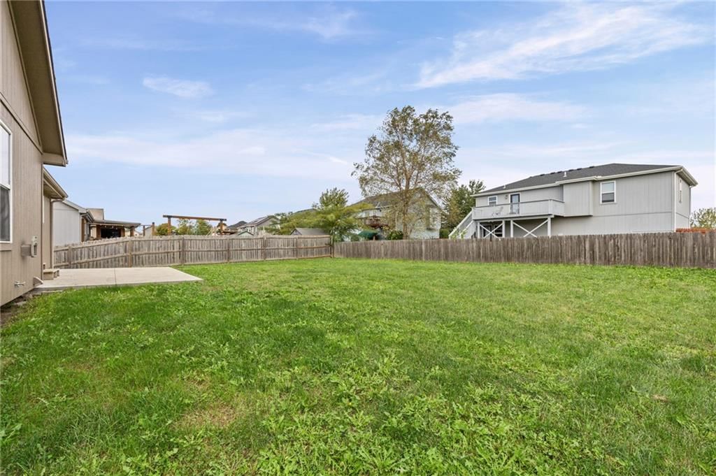 Big backyard, fenced yard and wood fence at 502 193rd Street, Smithville, MO 64089