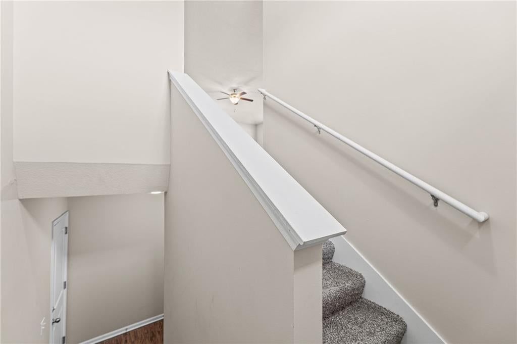 Staircase and white trim at 17176 S Kill Creek Road, Gardner, KS 66030