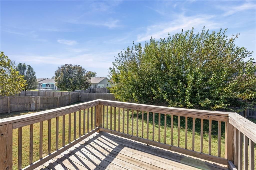 Deck, big backyard and fenced yard at 17176 S Kill Creek Road, Gardner, KS 66030