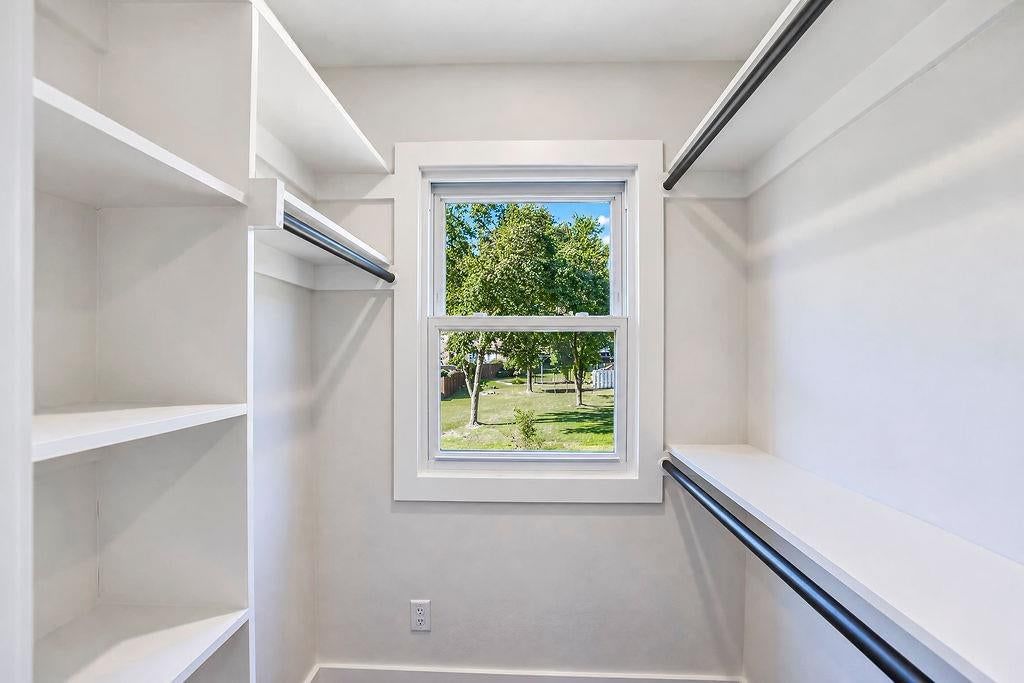 Walk-in closet at 9931 Woodson Drive, Overland Park, KS 66207