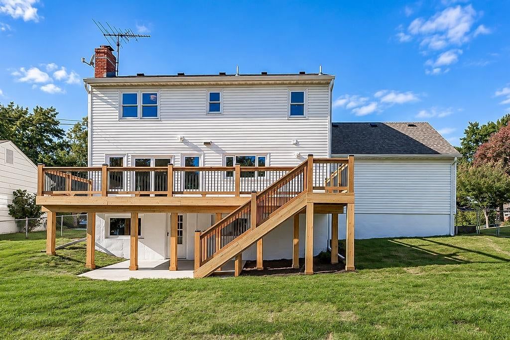 Deck, big backyard and wood deck at 9931 Woodson Drive, Overland Park, KS 66207