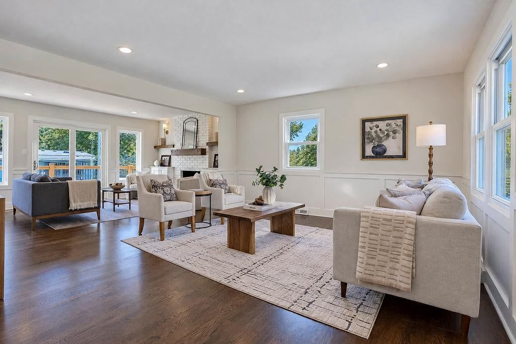 Open floor plan, hardwood floors and statement lighting at 9931 Woodson Drive, Overland Park, KS 66207