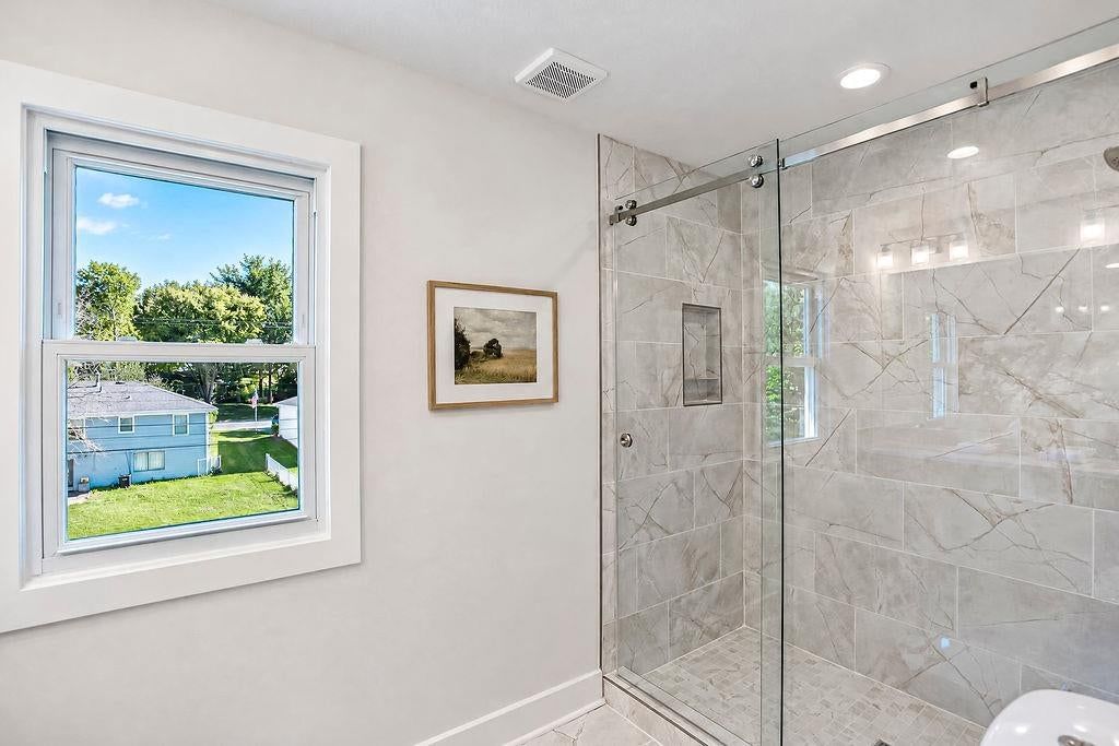 Walk-in shower at 9931 Woodson Drive, Overland Park, KS 66207